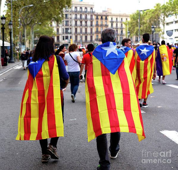 Marching Poster featuring the photograph Marching in Barcelona by John Rizzuto