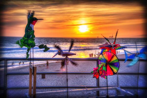 Huntington Beach Poster featuring the photograph Wind Chimes at Sunset by Spencer McDonald