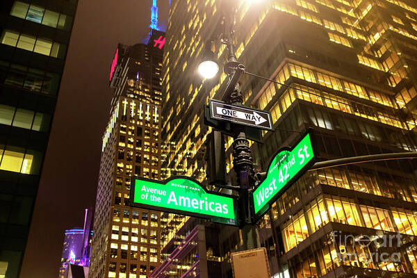 Avenue Of The Americas At Night Poster featuring the photograph Avenue of the Americas at Night New York City by John Rizzuto