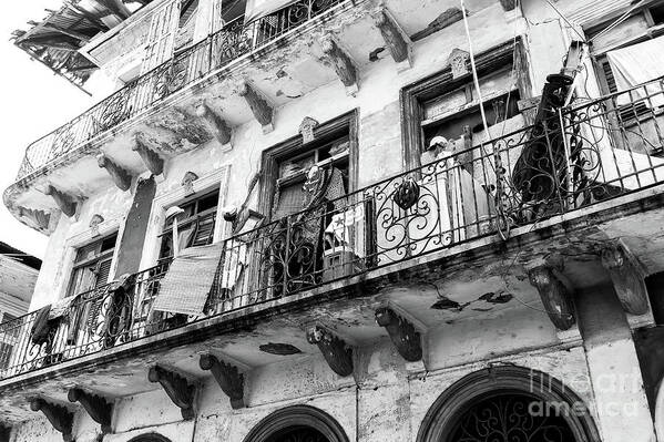 Under The Balcony Poster featuring the photograph Under the Balcony in Casco Viejo by John Rizzuto