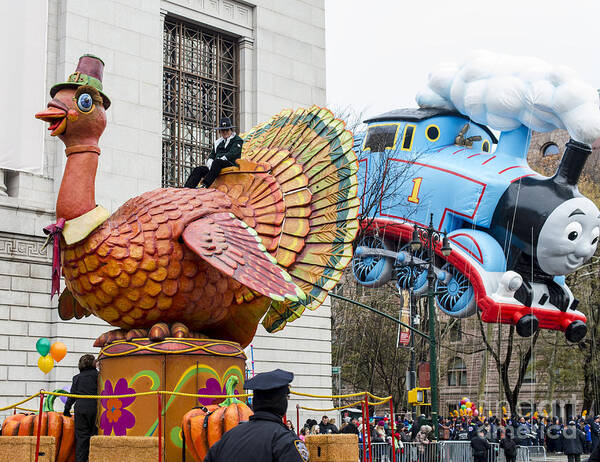 Macy's Thanksgiving Day Parade Poster featuring the photograph Tom Turkey Float and Thomas the Tank Engine Balloon at Macy's Thanksgiving Day Parade #1 by David Oppenheimer