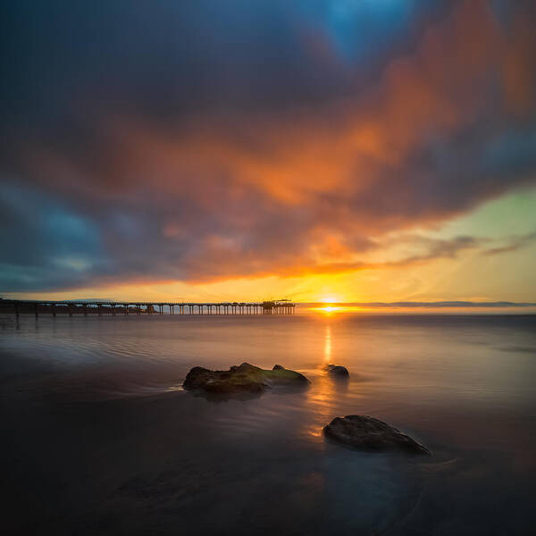 California; Long Exposure; Ocean; San Diego;seascape; Sky; Sunset; Sun; Clouds; Pier; Scripps; Reef; Waves; Reflections Poster featuring the photograph Scripps Pier Sunset 2 - Square by Larry Marshall