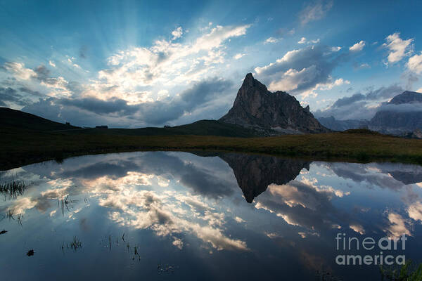 Dolomites Poster featuring the photograph Mountain peak and clouds reflected in alpine lake in the Dolomit by Matteo Colombo