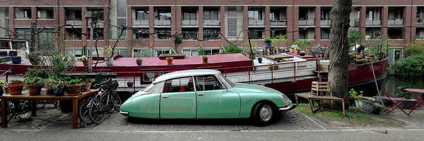 Amsterdam Poster featuring the photograph Classic citreon car and canal boathouse Amsterdam by Sonny Ryse