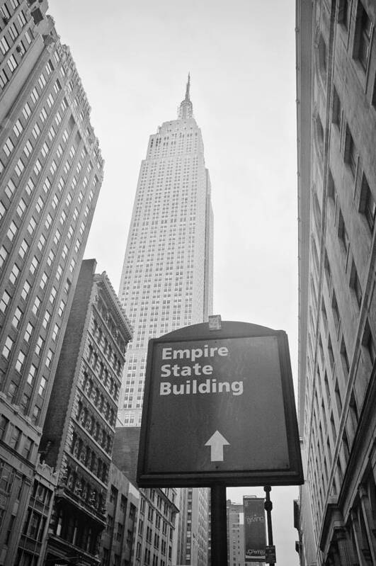 New York Poster featuring the photograph The Empire State Building in New York City #2 by Ilker Goksen