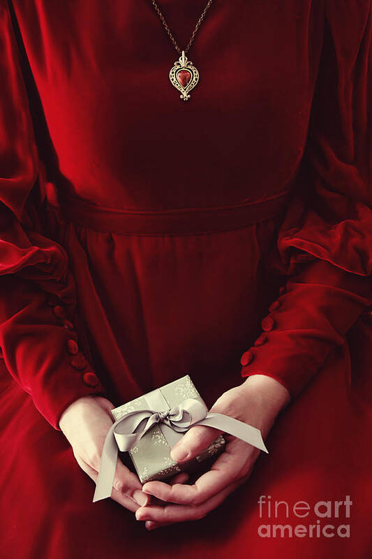 Atmosphere Poster featuring the photograph Woman in red dress holding small gift #2 by Sandra Cunningham
