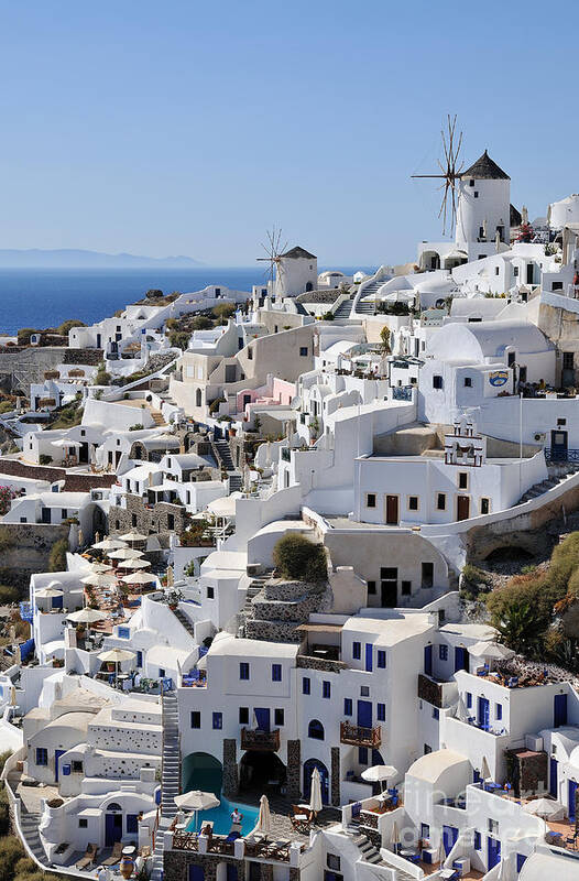 Santorini Poster featuring the photograph Windmills and white houses in Oia by George Atsametakis