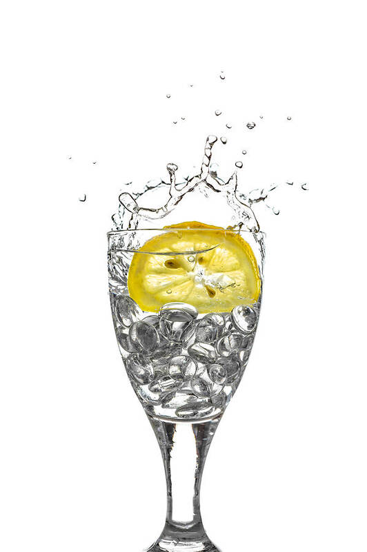 Alcohol Poster featuring the photograph Slice of lemon in Glass #6 by Peter Lakomy