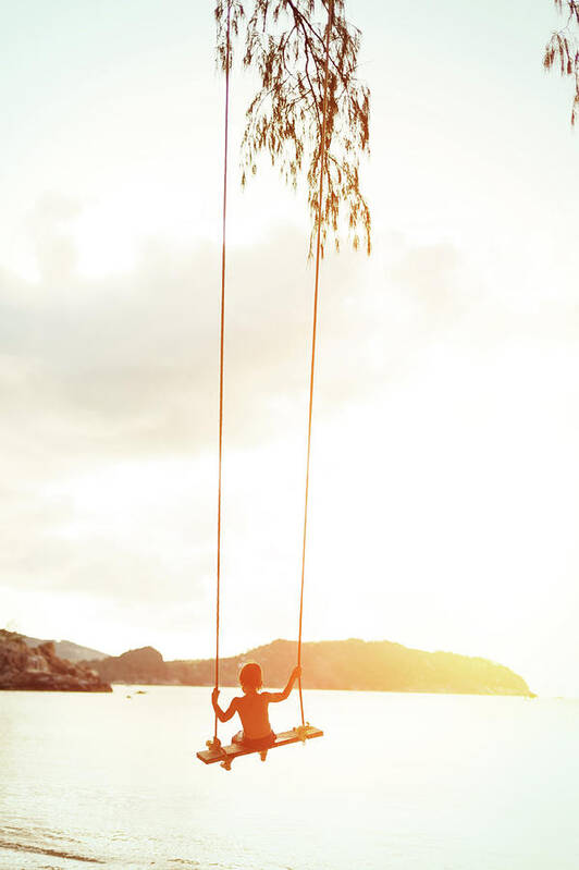 Rope Swing Poster featuring the photograph Boy On A Rope Swing by Arand