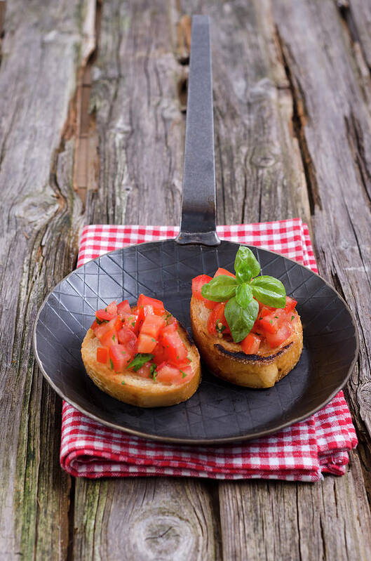 Italian Food Poster featuring the photograph Bruschetta In Frying Pan On Napkin by Westend61