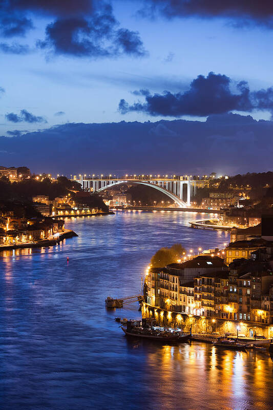 Porto Poster featuring the photograph City of Porto by Douro River at Night in Portugal by Artur Bogacki