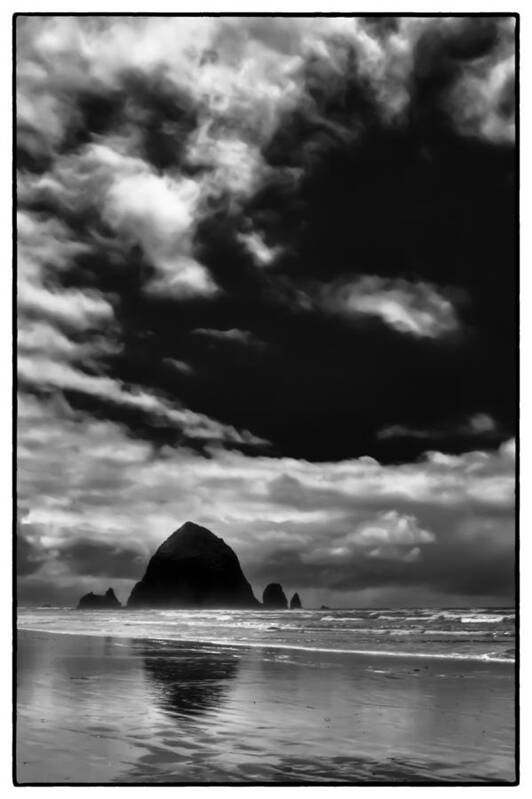 Cannon Beach Poster featuring the photograph Clouds over Haystack Rock on Cannon Beach by David Patterson