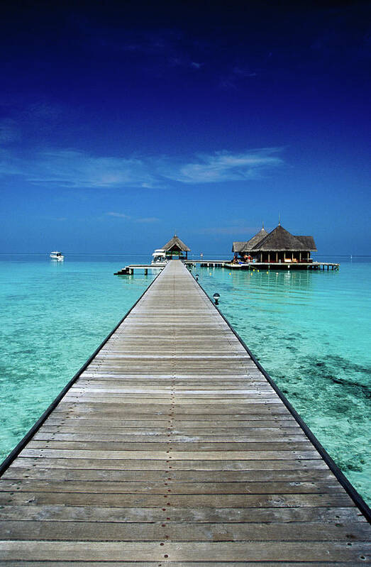 Tranquility Poster featuring the photograph Club Med Kani, Long Pier Surrounded By by Izzet Keribar