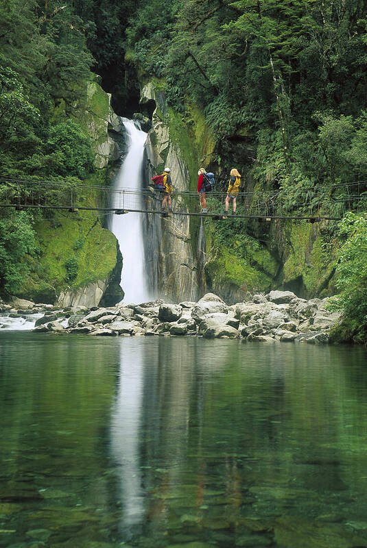 Feb0514 Poster featuring the photograph Hikers On Bridge Giants Gates Falls by Colin Monteath