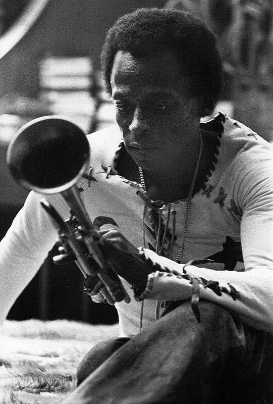 Artist Poster featuring the photograph Jazz Musician Miles Davis Looking At His Trumpet by Mark Patiky