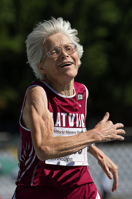 One Person Poster featuring the photograph Joyful Senior Female Athlete by Alex Rotas