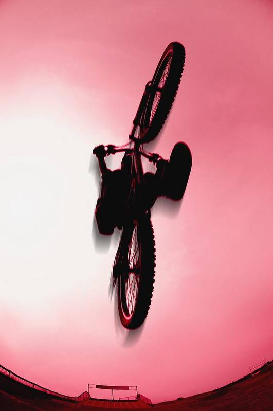 Extreme Poster featuring the photograph Silhouette Stunt Bike Rider by Corey Hochachka