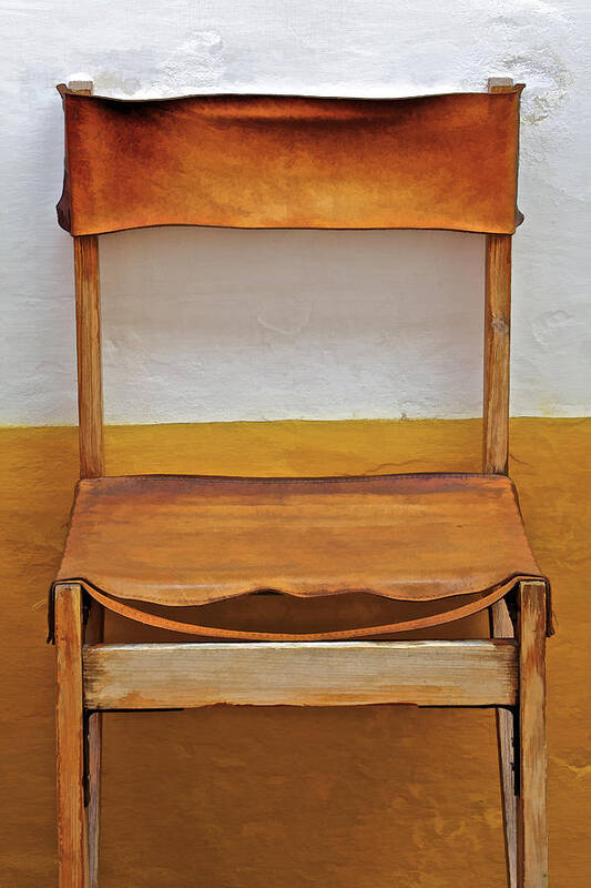 Artistic Poster featuring the photograph Worn Leather Outdoor Cafe Chair by David Letts