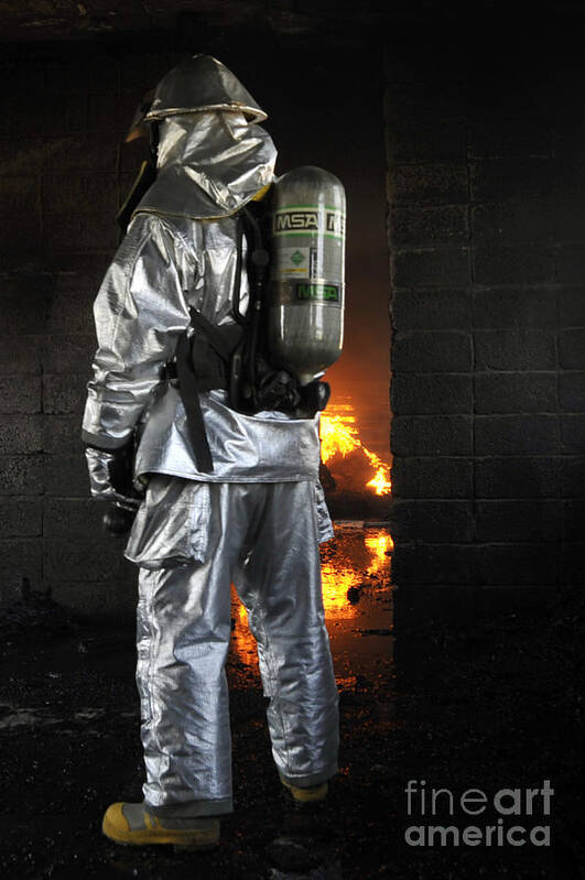 Operation Iraqi Freedom Poster featuring the photograph A Firefighter Waits For A Fire To Get by Stocktrek Images