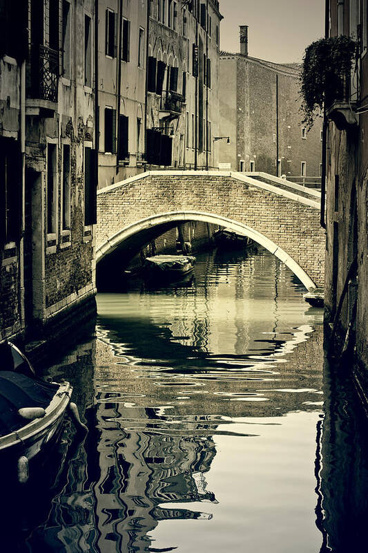 Venice Poster featuring the photograph narrow channel with a bridge in Venice by Joana Kruse