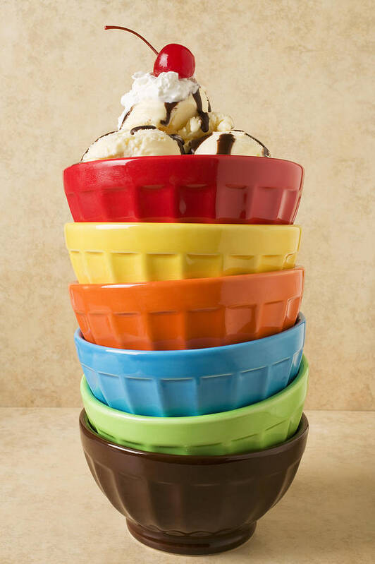 Bowls Poster featuring the photograph Stack of colored bowls with ice cream on top by Garry Gay