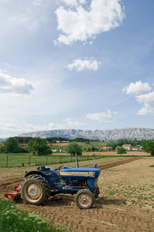 Vertical Poster featuring the photograph Tractor On Farm Field, Trets, France by Jupiterimages