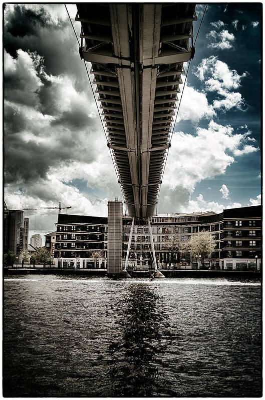 Briannia Village Poster featuring the photograph A water skier speeds past The Royal Victoria Dock Bridge #1 by Lenny Carter