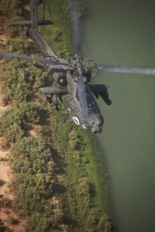 Ah-64 Poster featuring the photograph An Ah-64d Apache Helicopter In Flight #3 by Terry Moore