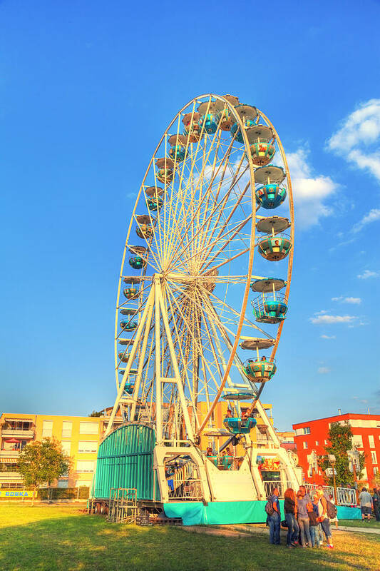 Action Poster featuring the photograph A Big Ferris Wheel On A Carnival by Gina Koch