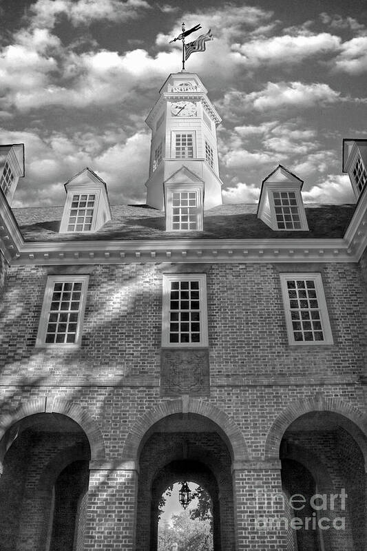 Colonial Williamsburg Capital Building Autumn Fall Leaves Color Morning Duke Of Gloucester Street Virginia Clouds Blue Sky Flag Black And White Poster featuring the photograph Capital Colonial Williamsburg B and W by Karen Jorstad