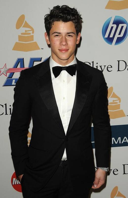 Nick Jonas Poster featuring the photograph Nick Jonas In Attendance For Clive by Everett