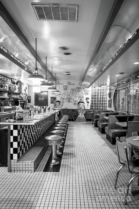 Route 66 Diner; Diner; Classic; Stools; Booths; Memorabilia; Betty Boop; Fountain; Soda Fountain; Malts; Shakes; Burgers; Albuquerque; Nm; New Mexico; Night; Route 66; Rt 66; Black And White; Bw; B&w;mother Road Poster featuring the photograph Route 66 Diner by Imagery by Charly