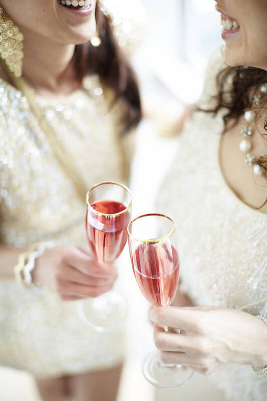 Caucasian Poster featuring the photograph Two Giggling Ladies Toasting Champagne by Gillham Studios