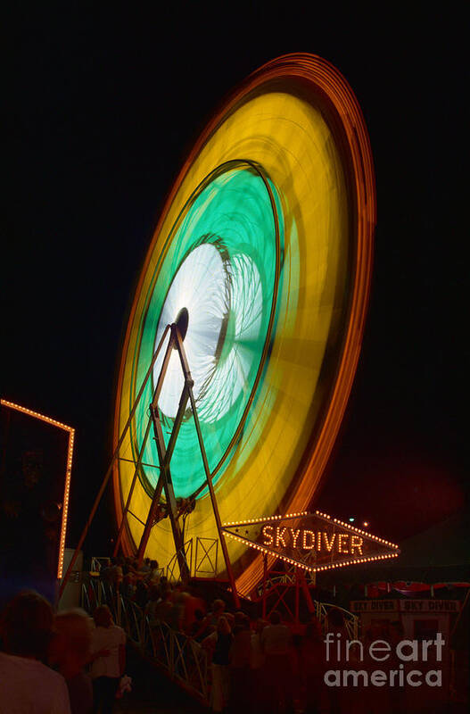 Blurred Motion Poster featuring the photograph Ferris Wheel In Motion #1 by Bettmann