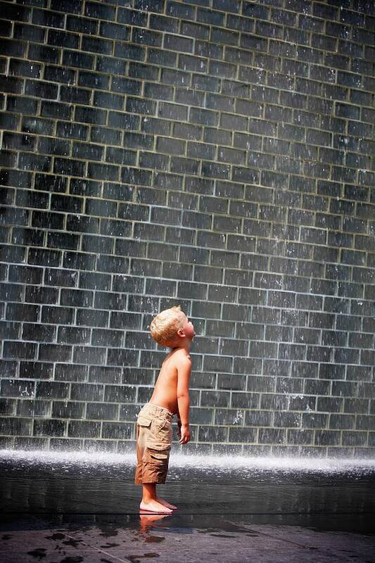 4-5 Years Poster featuring the photograph A Boy Standing Beside A Wall Fountain by Design Pics