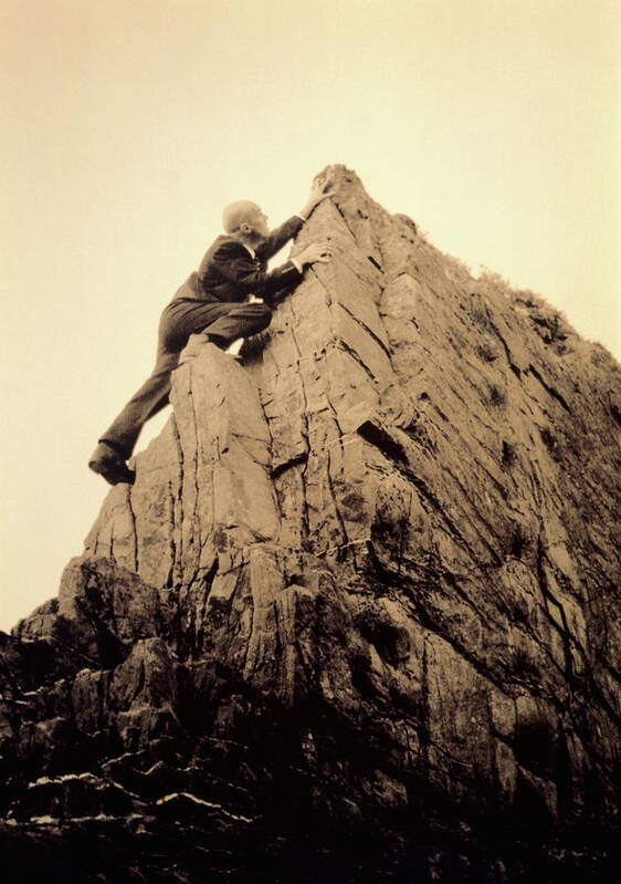 Corporate Business Poster featuring the photograph Businessman Climbing Jagged Rock, Low by Betsie Van Der Meer