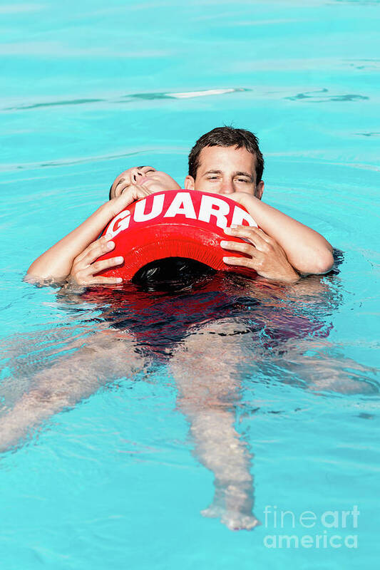 Lifeguard Poster featuring the photograph Lifeguard Rescuing Woman by Microgen Images/science Photo Library