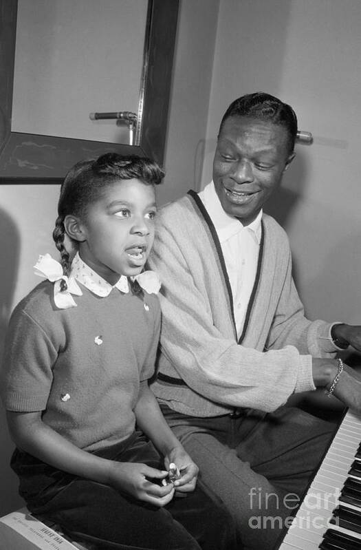 Singer Poster featuring the photograph Nat King Cole And Natalie Singing by Bettmann