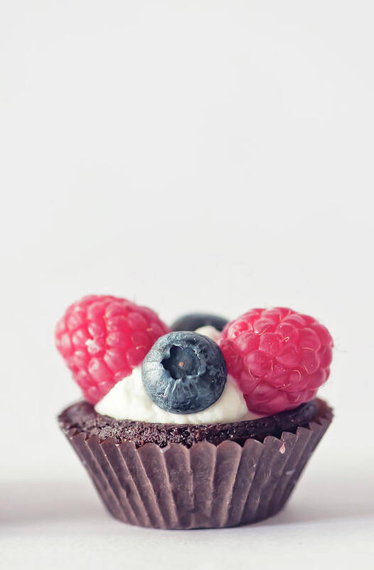 Unhealthy Eating Poster featuring the photograph Raspberries And Blueberries Cupcake by Marta Nardini