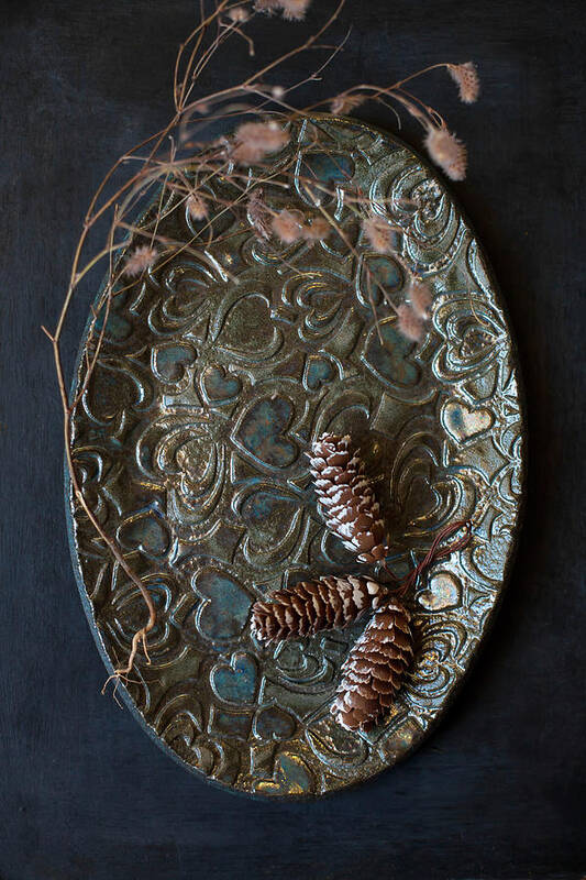 Ip_12417663 Poster featuring the photograph Three Pine Cones On Oval Plate With Embossed Love-heart Pattern by Alicja Koll