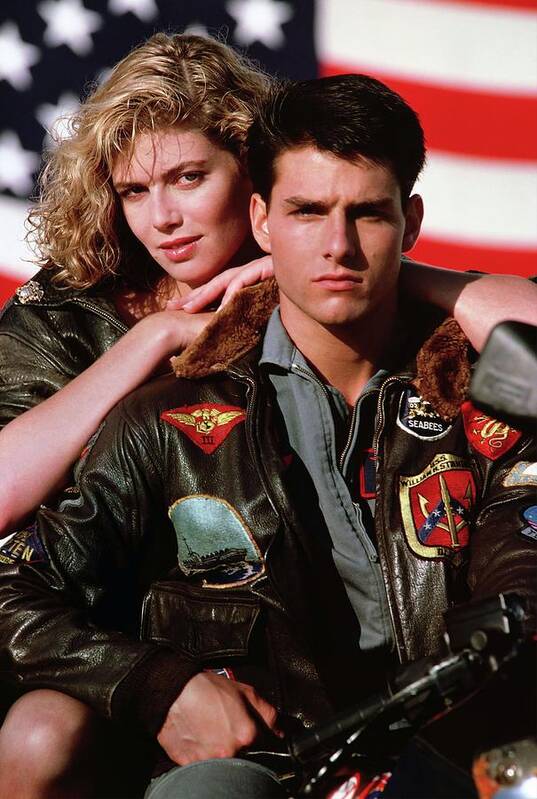 Kelly Mcgillis Poster featuring the photograph TOM CRUISE and KELLY MCGILLIS in TOP GUN -1986-. by Album