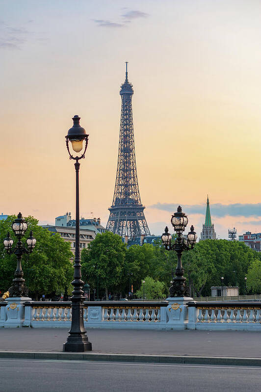 Paris Poster featuring the photograph Eiffel tower and lamppost with orange sky by Philippe Lejeanvre