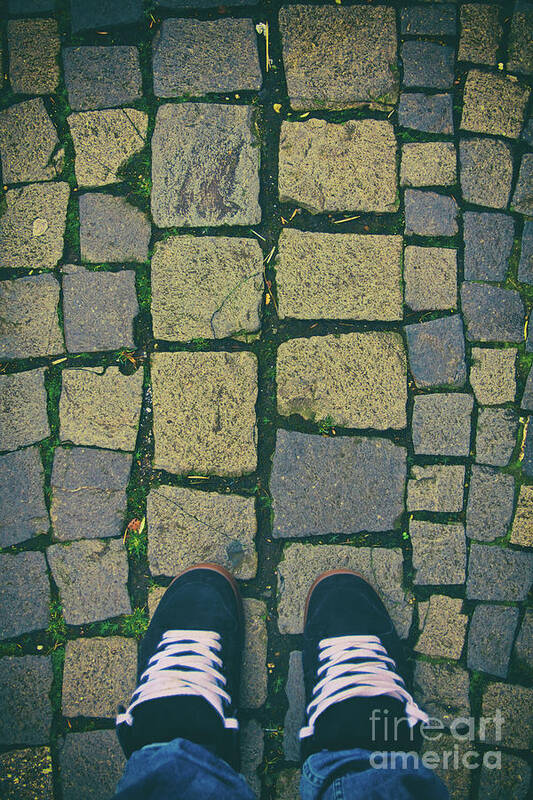 Sneakers Poster featuring the photograph Feet in urban sneakers on cobblestones by Mendelex Photography