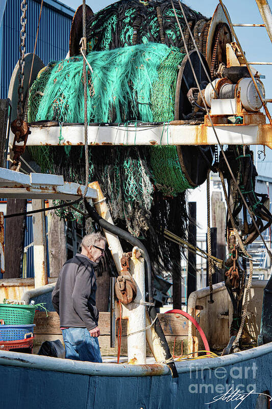 Fisherman Poster featuring the photograph Fisherman on His Boat by Meg Leaf