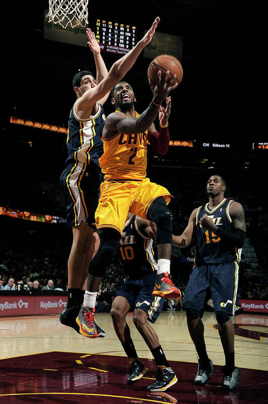 Kyrie Irving Poster featuring the photograph Kyrie Irving and Enes Kanter by David Liam Kyle