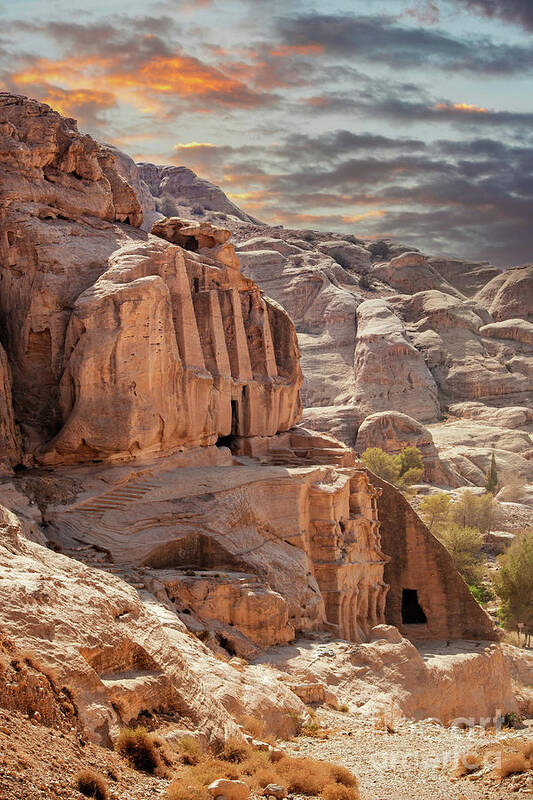 Petra Poster featuring the photograph Sunset at the lost city of Petra, Jordan. Amazing buildings are carved out of the pink rock and the Rose City dates to around 300 BC by Jane Rix