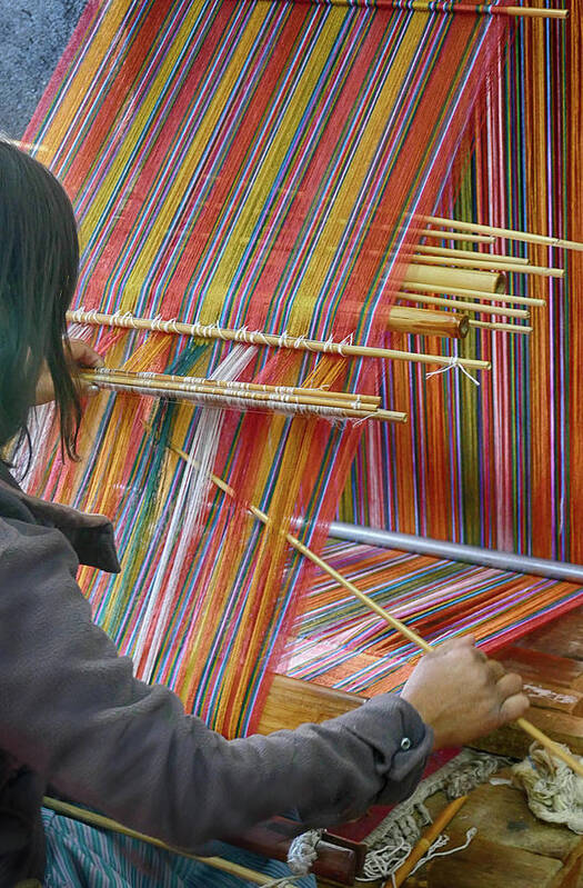 Bhutan Poster featuring the photograph Young woman working a backstrap loom by Steve Estvanik