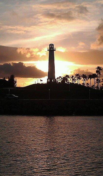 Lighthouse Poster featuring the photograph Lighthouse Sunset by John Glass