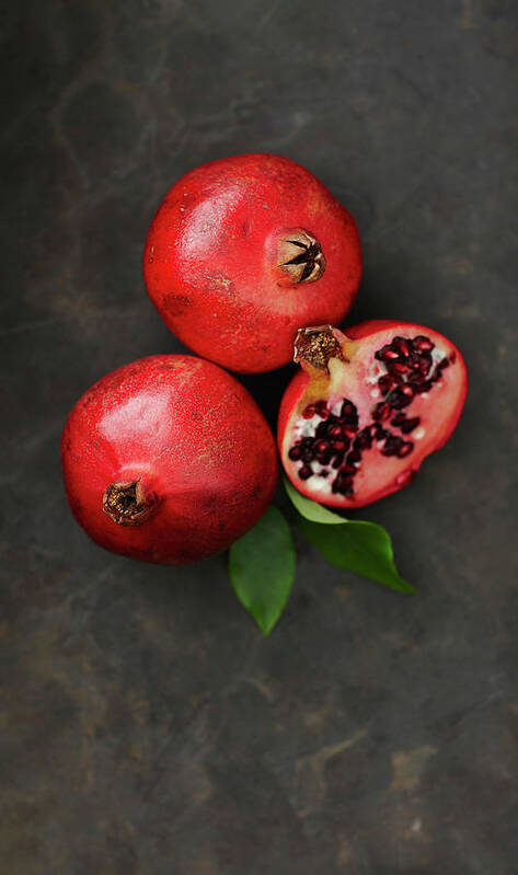 Pomegranate Poster featuring the photograph Pomegranates With Leaf, Close Up by Westend61