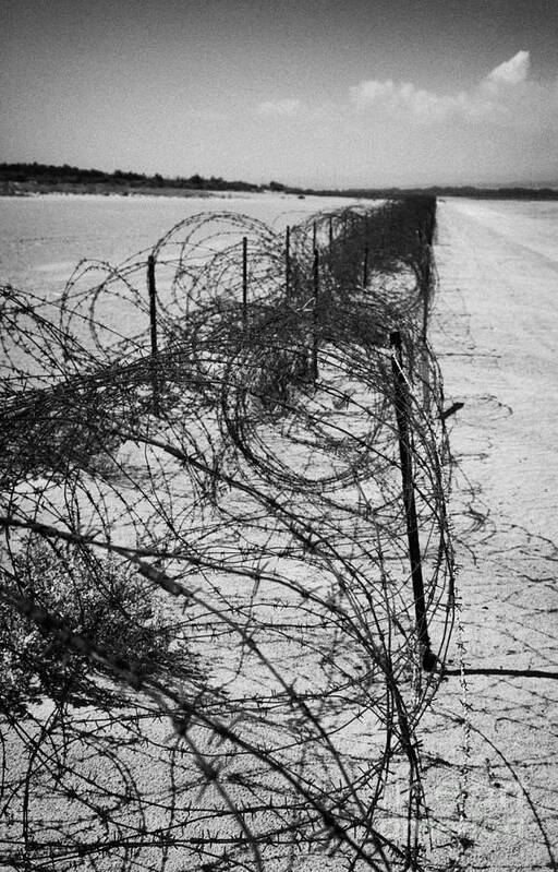 Rusty Poster featuring the photograph rusty barbed wire fence on the akrotiri salt flats the limit of the western Sovereign Base Area SBA #2 by Joe Fox